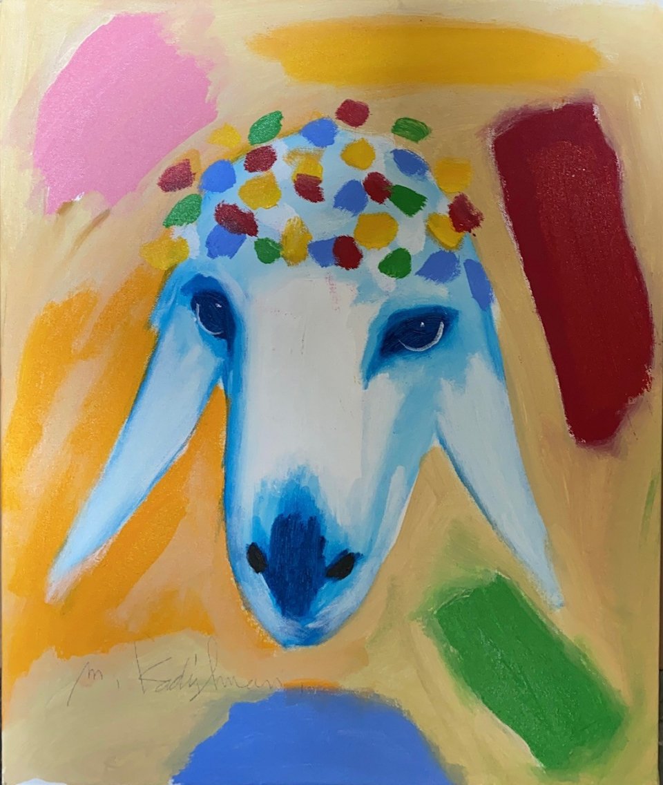ראש כבש על רקע צבעוני